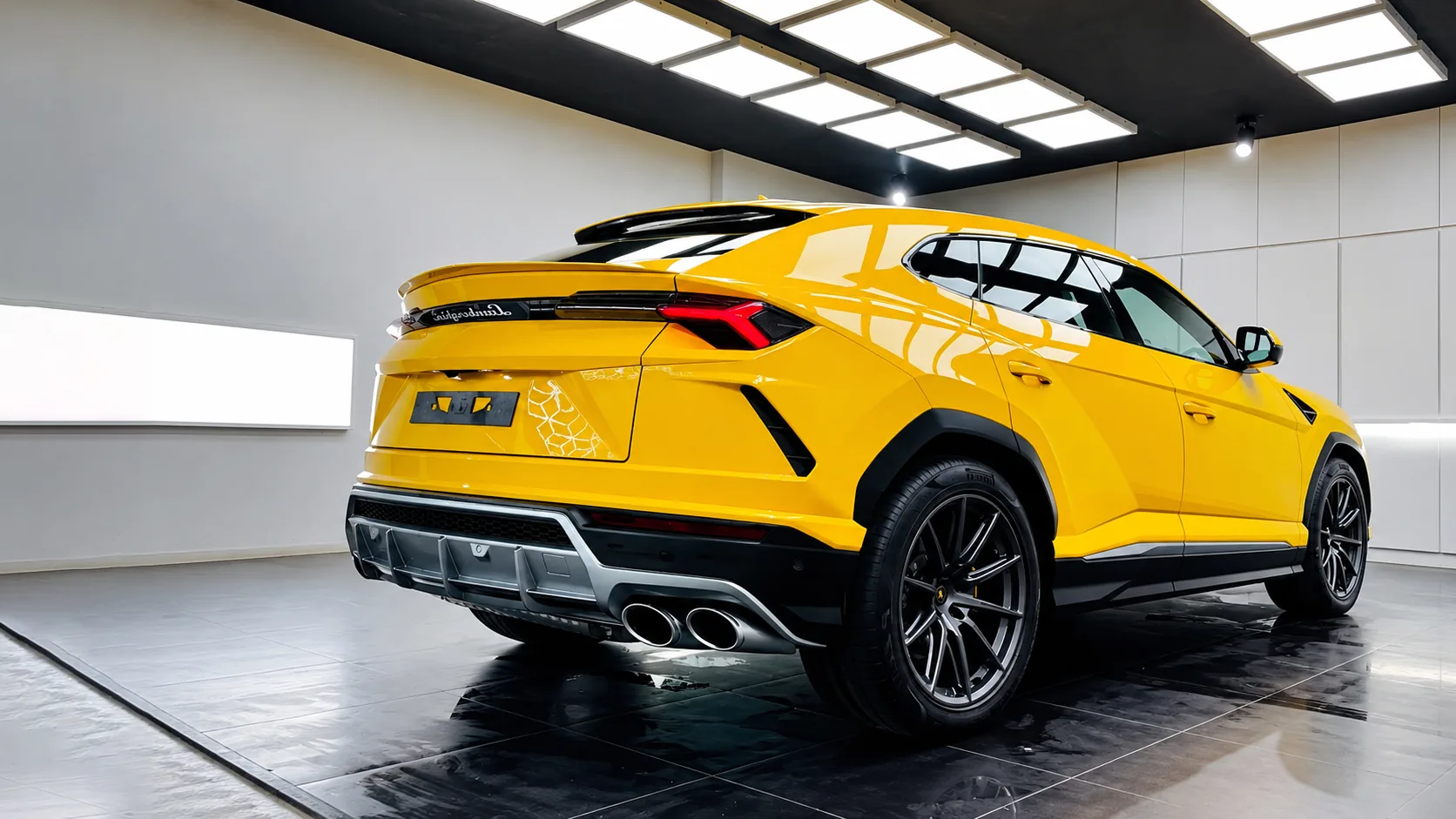 A yellow Lamborghini Urus with a clean, glossy finish inside The Detailing Mafia ECR studio