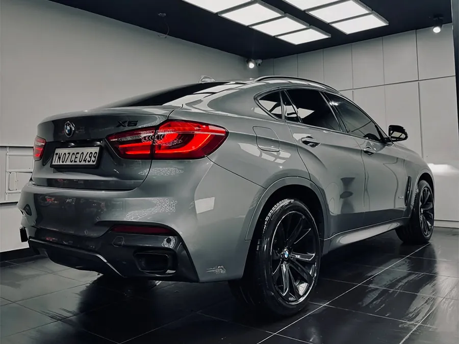 Grey BMW X6, rear view, at our ECR studio